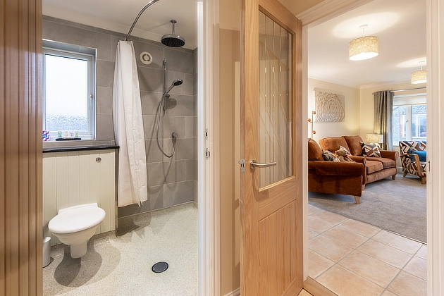 Home Farm End Cottage's downstairs shower room and lounge entrance views