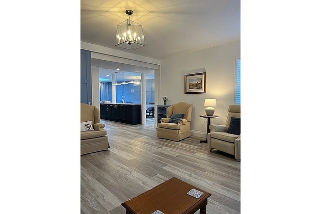 Barnfield Lodge's lounge looking to kitchen