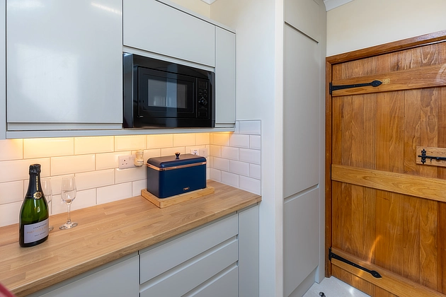 Plover Cottage's kitchen towards hall